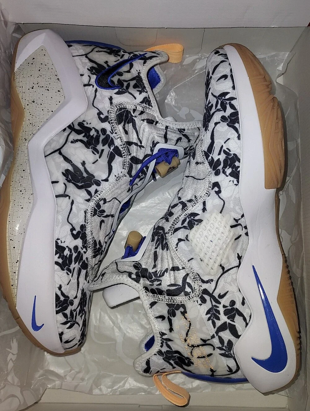 Nike Men’s White Floral Training Shoes with Black Print and Blue Details